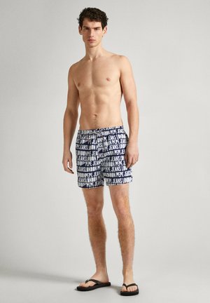 Bañador con un patrón azul y blanco que presenta el texto "PEPE JEANS LONDON", hecho de una tela ligera. Complementado con una cintura ajustable.