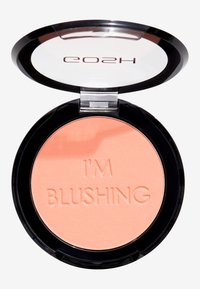 Runder Rouge-Compact mit schwarzem Gehäuse und transparentem Deckel. Das innere Puder ist ein sanftes Pfirsich und trägt die Prägung "I'M BLUSHING" auf der Oberfläche.