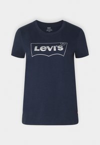Námořnická modrá bavlněná trička s kovově stříbrným logem Levi's v klasickém designu. Krátké rukávy a střih s kulatým výstřihem.