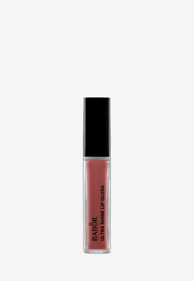 Babor Ultra Shine Lip Gloss in un tubo trasparente, con un cappuccio nero. Il gloss ha una tonalità rosa chiaro con una finitura liscia e lucida.