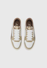 Light brown and white athletic shoes with a perforated toe, white laces, padded collar, and logo detailing on the tongue and sides.