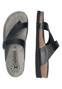 Sandales en cuir noir avec des brides croisées, semelle en liège, semelle intérieure en suède gris et semelle extérieure en caoutchouc noir texturé. Détail de boucle ajustable.
