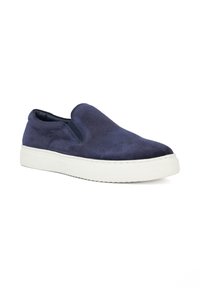 Navy suede slip-on shoe with elastic side panels, white rubber sole, rounded toe, and minimalistic design. Smooth texture with subtle stitching.