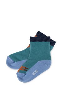 Socken aus Baumwollmischung mit einem Farbspektrum in Türkis, Marineblau und Blau. Mit einem braunen Akzent an der Spitze und gerippten Bündchen.