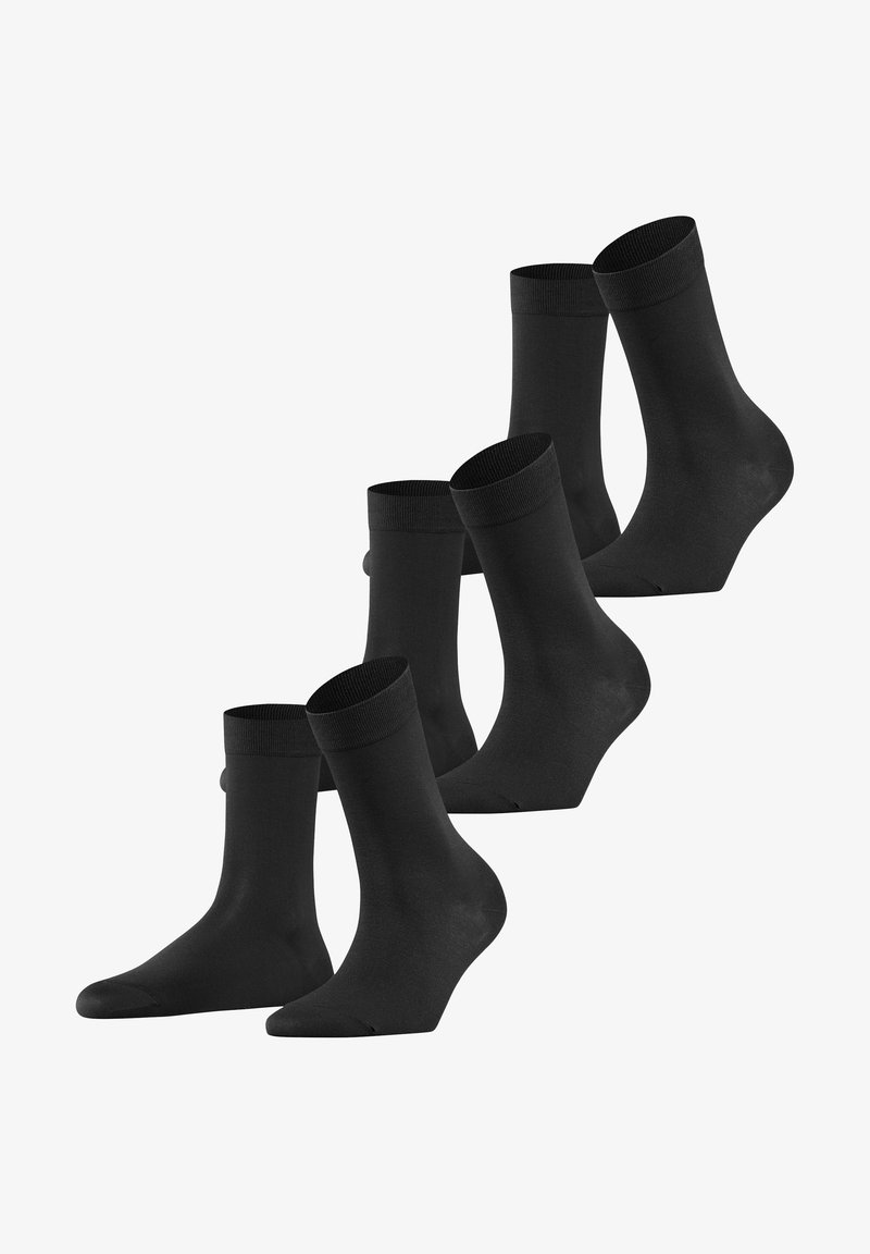 Mustad must socks, mille pehme tekstuuriga, pahkluu pikkuses ja ribaga äärega. Viis paari erinevates asendites.
