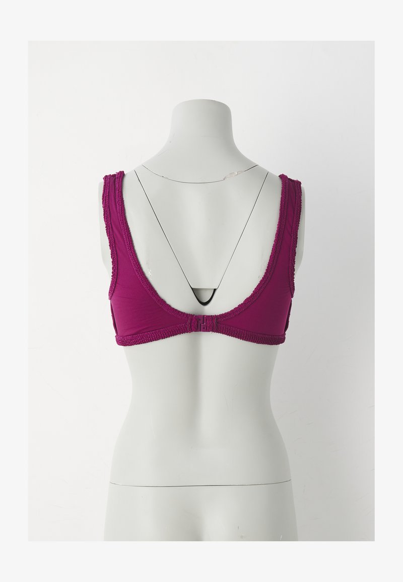 Purple fabric bra with adjustable straps, textured lace trim, and a hook-and-eye closure at the back, featuring a low scoop design.