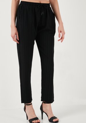 LELA SLIM FIT - Hlače - black