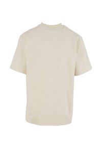 Kremfarget bomulls t-skjorte med rund hals og korte ermer; har en ensfarget design og en avslappet, uformell stil.