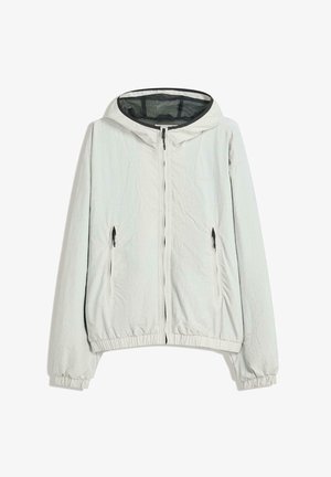 Hellgraue Kapuzenjacke mit Reißverschluss, schwarzen Reißverschluss-Anhängern, elastischen Bündchen und Saum sowie Netzfutter im Inneren der Kapuze.