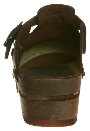 Brown wooden platform sandal with a closed back, soft interior lining, and decorative buckle detail. The sole features a textured surface.