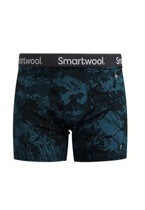 Blauwe en zwarte geblokte boxershorts gemaakt van zachte stof. Heeft een zwarte tailleband met het "Smartwool"-logo en een textuur met abstract ontwerp.