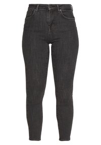 Jeans skinny de mezclilla negra con cintura alta, cinco bolsillos y un desvanecido sutil, con costuras estándar y cierre de cremallera.