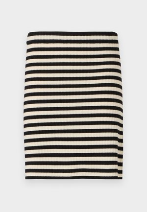 Mini-jupe rayée noir et blanc avec une texture côtelée. Elle possède une taille étroite et une coupe droite, conçue pour un port ajusté.