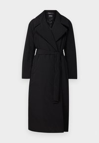 Black belted trench coat with wide lapels, long sleeves, and side pockets. Made from smooth, lightweight fabric.