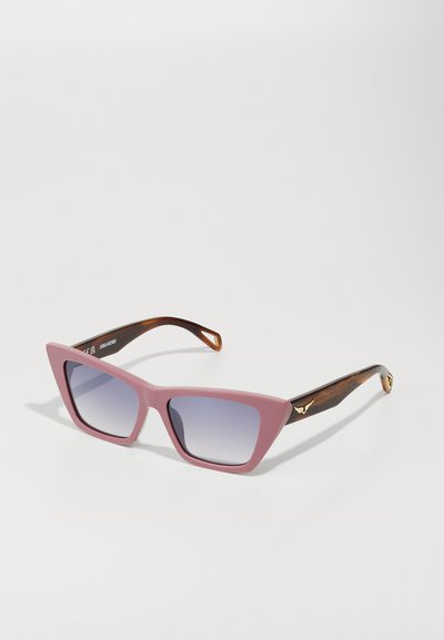 Pink cat-eye sunglasses with gradient lenses, featuring brown tortoiseshell arms and gold logo detailing on the temple.