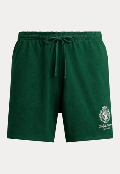 Grønne bomullsshorts med elastisk midjebånd, snøring og hvit brodert logo med et skjolddesign nederst til venstre.