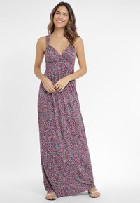 Lilla maxi kleit paisley mustriga, õhukeste rihmadega, V-kaelusega ja sobiva taljejoonega, mis voolab laienevasse seelikuosa.