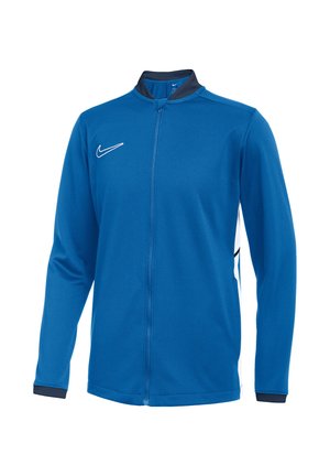 Blauer Sportjacke mit durchgehendem Reißverschluss, langen Ärmeln, schwarzem Kragen und Bündchen, weißem Nike Swoosh-Logo auf der Brust und weißen Seitenpaneelen.