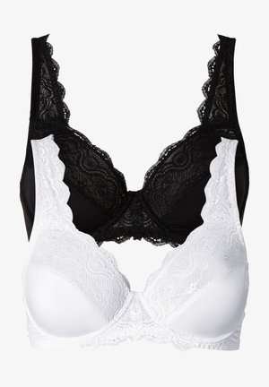 Soutiens-gorge en dentelle noir et blanc, avec des bords festonnés, un motif floral et des bonnets lisses, dotés de bretelles réglables et de fermetures à crochets.