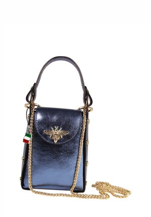 Metallic navy handbag with a bee emblem, gold hardware, chain strap, and rivet accents. Compact design with a top handle for carrying.