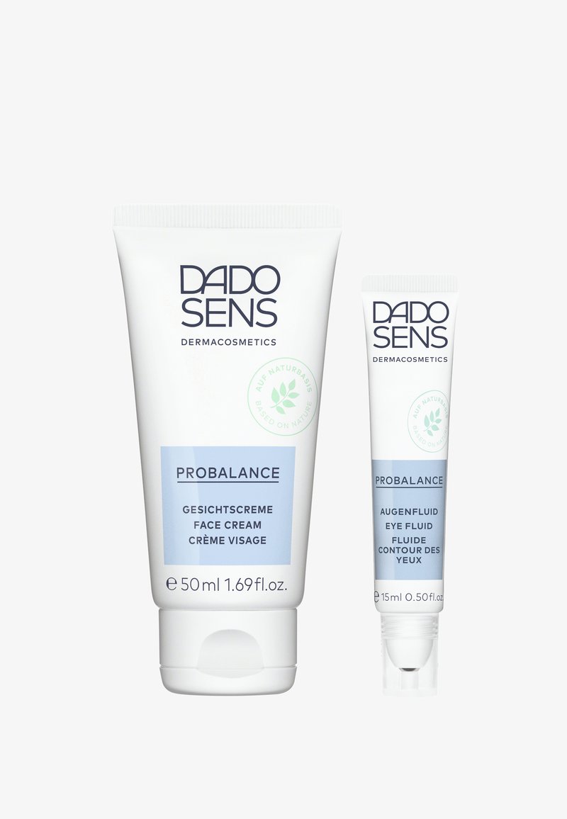 Two DADO SENS PROBALANCE skincare tubes: a white 50ml face cream with blue accents and a white 15ml eye fluid, both featuring clear labels.