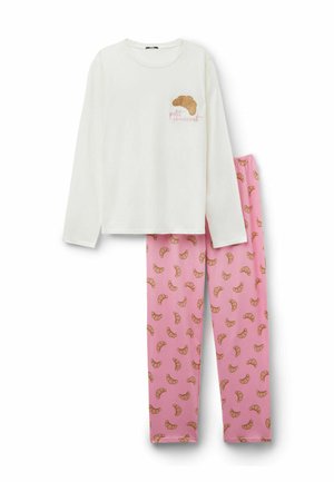 Haut à manches longues blanc avec motif de croissant ; pantalon rose avec motif de croissants répétitifs. Tissu en coton doux, coupe décontractée.