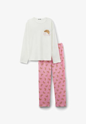 Haut à manches longues blanc avec motif de croissant ; pantalon rose avec motif de croissants répétitifs. Tissu en coton doux, coupe décontractée.