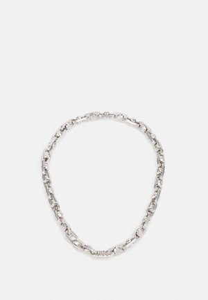 Silver chain necklace featuring interlocking oval and round links with a polished finish. Smooth texture with a shiny appearance.