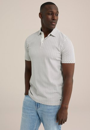 Korte mouwen polo shirt van lichte stof, met een geometrisch patroon van kleine zwarte pijlen, een contrasterende kraag en een ontspannen pasvorm.