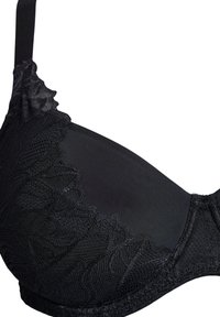 Reggiseno in pizzo nero con base a sottile filo, bordo in pizzo ondulato, spalline regolabili e dettagli testurizzati sulle coppe.