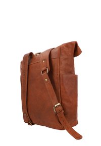 Brown leather messenger bag with a fold-over top, adjustable shoulder strap, and a side pocket. Smooth texture and brass hardware accents.