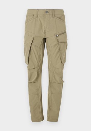 Pantalons cargo khaki en tissu résistant, dotés de plusieurs poches latérales, d'une coupe slim et d'accents de couture visibles.