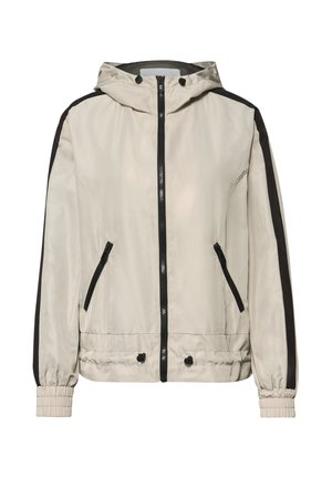 Beige capuchonjack met zwarte ritssluiting, zwarte zijstrepen, elastische manchetten en voorzakken met rits.