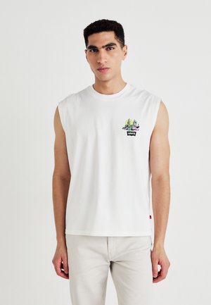 T-shirt sans manches blanche en coton, arborant un petit graphique de cactus coloré sur la poitrine, avec un logo Levi's en dessous.