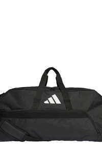 Black duffel bag with a textured finish, featuring two top handles, an adjustable shoulder strap, and a large white logo on the side.