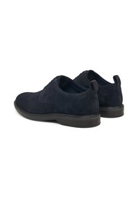 Scarpe in suede blu navy con una superficie liscia, punta rotonda e design con lacci. Presentano una suola in gomma scura a contrasto e un tallone rinforzato.