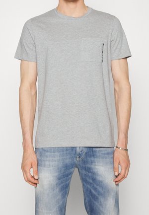 Gray cotton t-shirt with short sleeves, round neckline, and a front pocket. Features a small logo printed near the pocket.