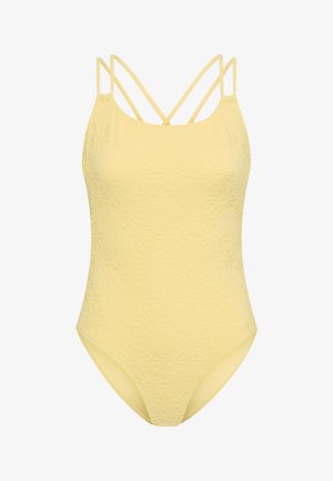 Geltona vientisa maudymosi kostiumėlis su įspaustu gėlių raštu, plonais pasikryžiuojančiais petnešėliais. Lygus audinys su aptempta silueto forma.