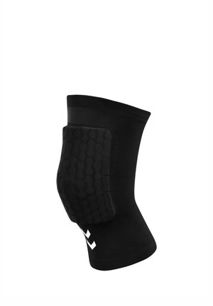 Manchon de genou rembourré noir avec coussinet protecteur texturé et logo chevron blanc sur fond blanc.
