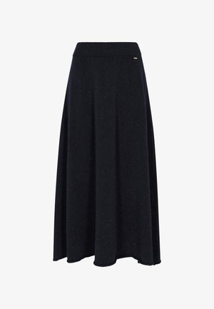 Mustat A-linjaiset midi-hameet, joissa on ribattu vyötärö ja hienovarainen täplikkäitä tekstuureja, virtaavat pehmeiden laskosten kanssa.