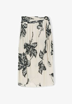 Bloemenrok in crème met zwarte bloempatronen. Voorzien van plooien en een ronde knoopaccent bij de taille. Lichte stof.