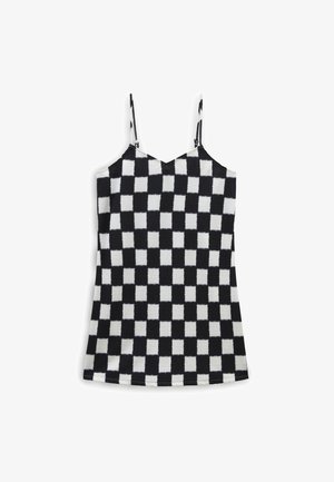 Vestido sin mangas de cuadros en blanco y negro con tirantes finos ajustables, silueta entallada y tejido ligeramente texturizado.