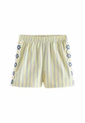 Hellgelbe Shorts mit vertikalen dunkelblauen Streifen, elastischem Bund und blau-weißem, besticktem Blumenbesatz entlang der Seitennaht.