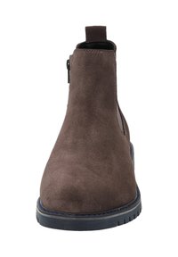Stivale alla caviglia in suede marrone con una superficie liscia, zip esterna, linguetta sul tallone e una resistente suola in gomma nera.