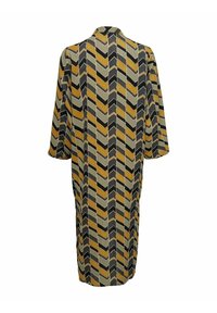 Long, loose-fitting dress in a chevron pattern of black, mustard, and gray colors, with a simple collar and three-quarter sleeves.