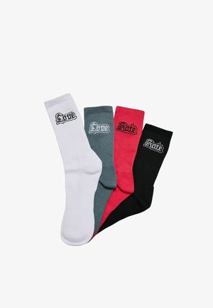 Štiri pare bombažnih nogavic: bele, sive, rdeče in črne, vsaka z rebrasto teksturo in izvezeno besedilo "Ljubezen" ali "Sovraštvo" v kontrastni barvi.