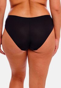 Mustat bikinit, joissa on sileä pinta, korkea leikkaus ja kohtalainen peittävyys, litteillä saumoilla ja minimalistisella tyylillä.