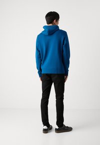 BOSS SAGGY - Tröja med dragkedja - open blue