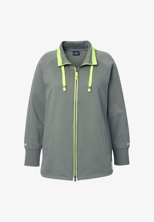 Harma zip-up takki, jossa on korkea kaulus, neonvihreät korostukset, kiristysnarut ja sivutaskut. Valmistettu teksturoidusta kankaasta; löysä malli.