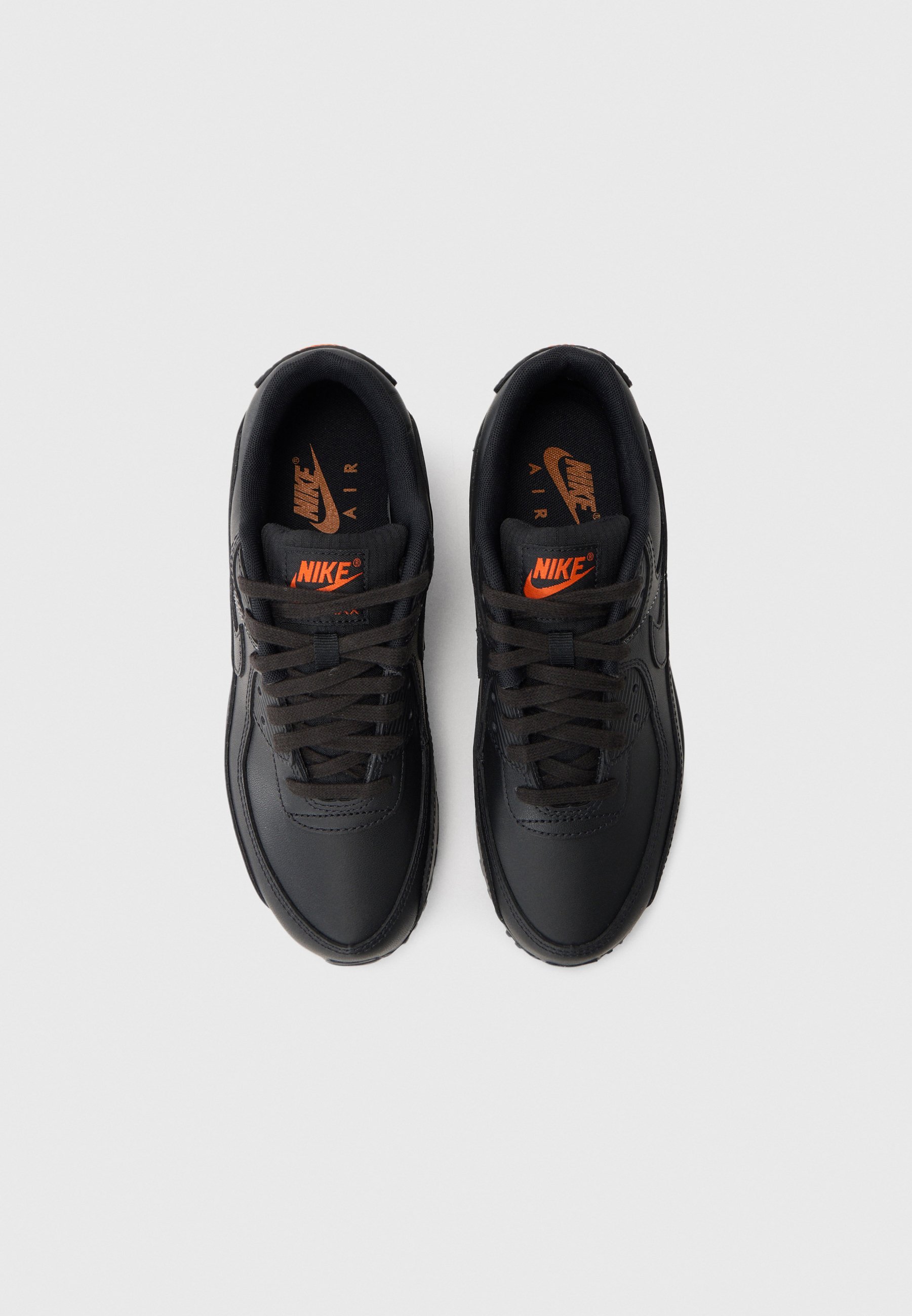 black nike with orange